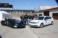 Team members with the inspected EVX Focus and GT