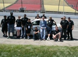 Team members with the Focus at the Track